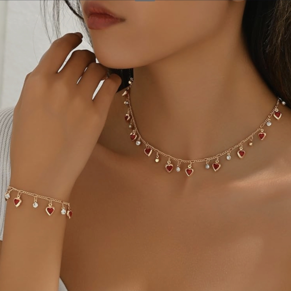 Elegant Gold Necklace with Red Heart Charms